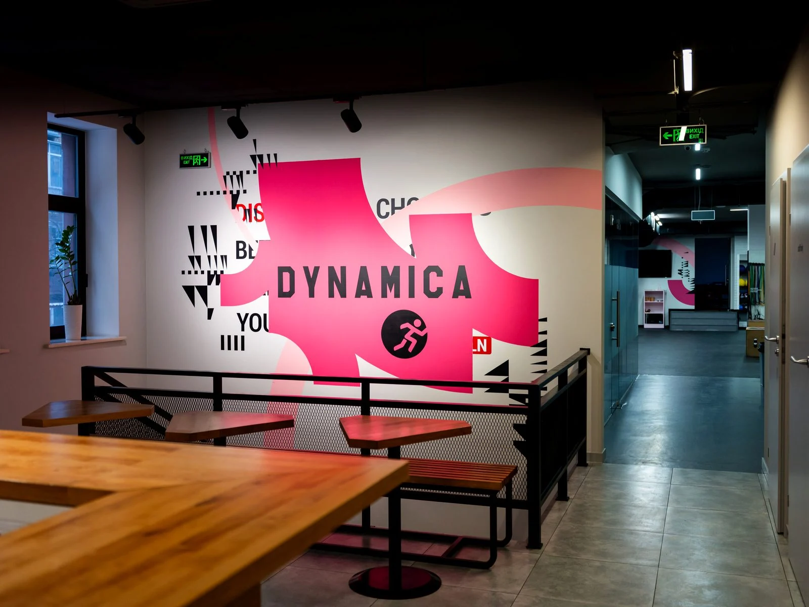 Lounge area at Dynamica with branded wall